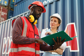 Obraz premium Foreman control Industrial Container Cargo freight ship at industry. Transportation and logistic.