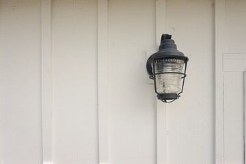 Black Light Fixture Mounted on White Wood board Wall
