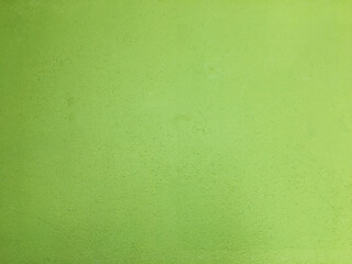 The walls are plastered with green paint.