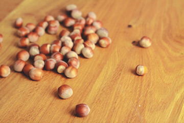 hazelnuts on wooden background