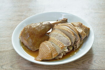 boiled duck meat dressing black soybean sauce chop and arranging on plate
