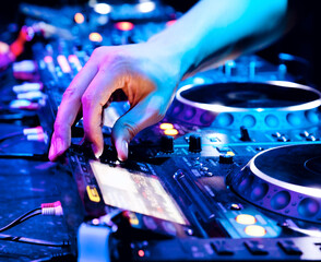 Dj playing the track in the nightclub at a party