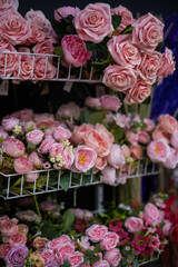 Flower texture background for wedding scene. Roses, peonies and hydrangeas, artificial flowers on the wall. Banner fow website.