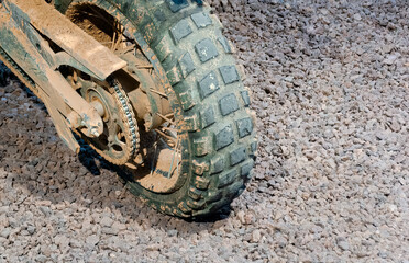 motorcycle wheel on gravel after racing