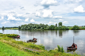 Fishing boats in the Maas. The Netherlands.The Land of Maas and Waal is beautiful to discover on foot or during a bike ride. Netherlands, Holland, Europe