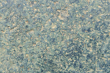 Old marble background. Stone texture with spots and cracks. Cracked vintage wall