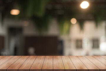 Empty wooden table top with lights bokeh on blur restaurant background.