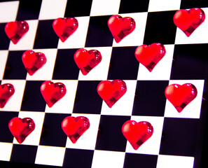 Images of hearts colored on a chessboard.