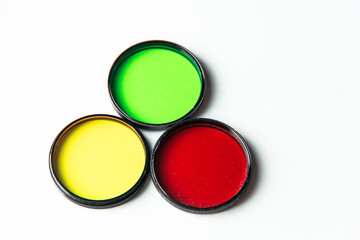 Multi-colored light filters on a white background.