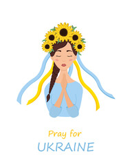 Beautiful ukrainian woman in a wreath with sunflowers prays for Ukraine. Stop war.