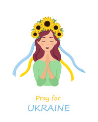 Beautiful ukrainian woman in a wreath with sunflowers prays for Ukraine. Stop war.
