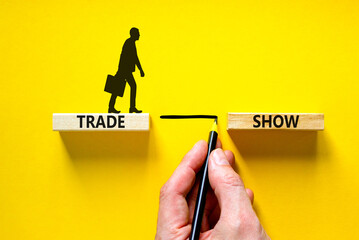 Trade show symbol. Wooden blocks with concept words Trade show on beautiful yellow background....