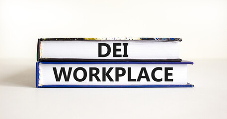 DEI diversity equity inclusion workplace symbol. Books with words DEI workplace on beautiful white background. Business DEI diversity equity inclusion workplace concept. Copy space.