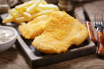 Breaded chicken meat or Schnitzel with french fries