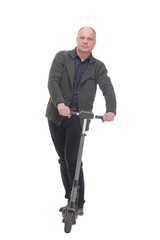 Naklejka premium happy casual man with electric scooter .isolated on a white background.