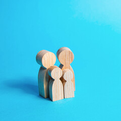 Family figures on a blue background. Parents and kids. Health and family planning. Reproduction....