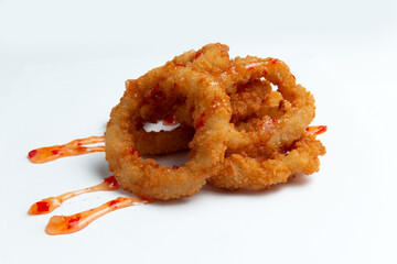 Fried onion rings. On a white background.