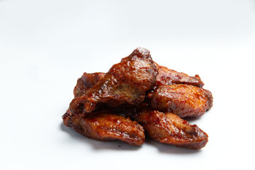 Fried chicken wings and thighs. On a white background.