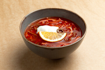 Traditional hodgepodge soup. On a brown background.