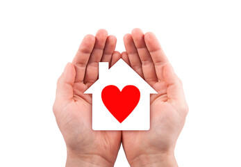 Obraz premium Paper house with red heart cutout in hands isolated on white background with clipping path. 