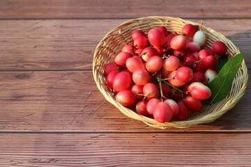 Bengal Currants or Carandas, top view, farmer holding a basket of fresh Carandas