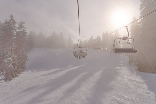 skilift in the austrian alsp near Bregenz on a misty but sunny day