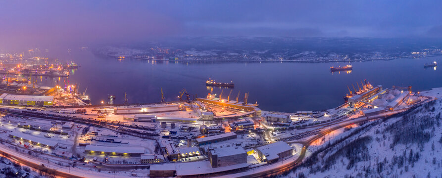 Panoramic aerial view of Kola bay and Murmansk Sea port on polar night. Murmansk, Russia.