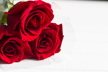 Red roses bouquet white background.