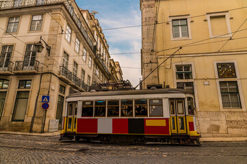 A view of typical street traffic in the Bairro Alto distict in the city of Lisbon on a spring day