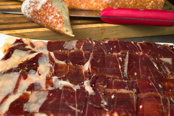Iberian Ham. Spanish ham platter, typical product, with artisan bread