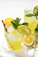 Fresh Lemonade or mojito cocktail with lemon, mint and ice