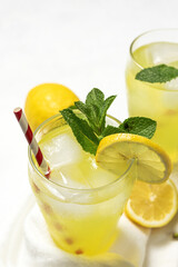 Fresh Lemonade or mojito cocktail with lemon, mint and ice
