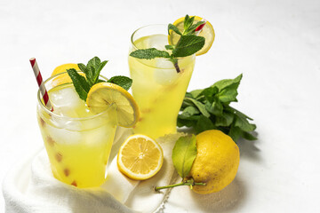 Fresh Lemonade or mojito cocktail with lemon, mint and ice
