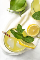 Fresh Lemonade or mojito cocktail with lemon, mint and ice