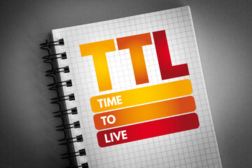 TTL - Time to Live acronym on notepad, technology concept background