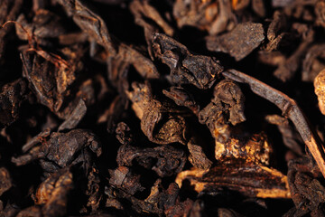 Chocolate black leaf shu pu-erh tea with cocoa beans close-up macro photography