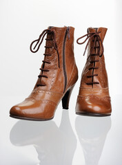 Рair of light autumn women's shoes, with a reflection in the glass