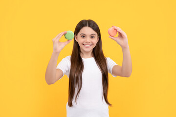 positive child with dessert bakery. kid hold french macaron. macaroon cookie.