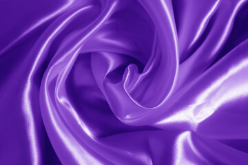 Fototapeta premium The texture of the proton purple cloth with waves and shrugs. Shiny fabric.