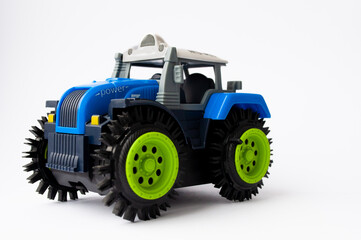 children's tractor on a white background, children's toys
