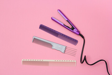  Сomposition with professional hairdresser tools on pink background. Flatlay.