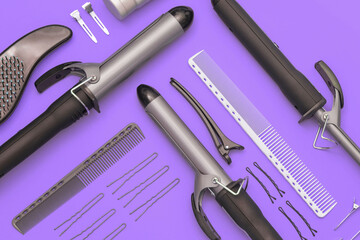  Сomposition with professional hairdresser tools on purple background. Flatlay.