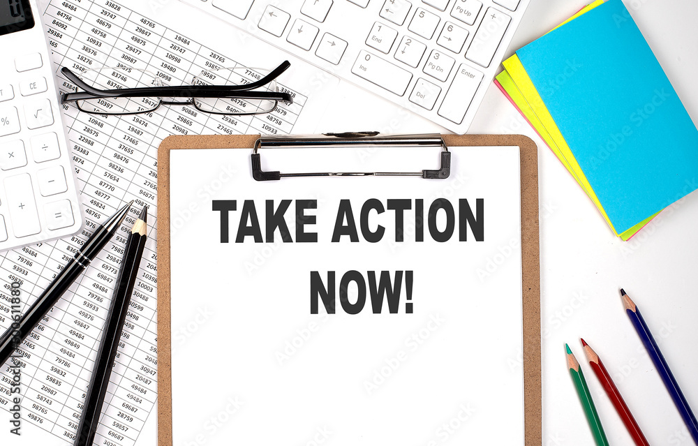 Poster clipboard with text take action now and keyboard and chart on white background.