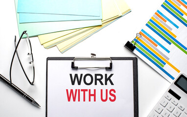 WORK WITH US text on paper sheet with chart,color paper and calculator
