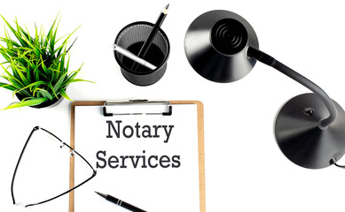 NOTARY SERVICES text on a clipboard on the white background