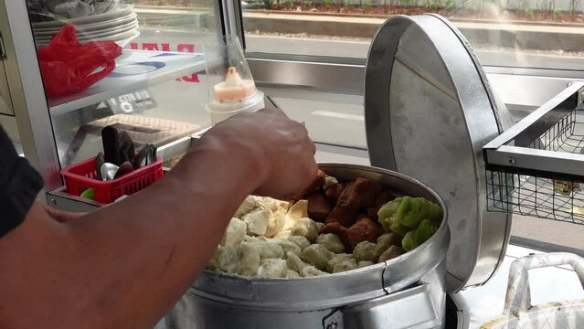 Siomay is a typical food from Bandung, Indonesia which is made from fish and served with vegetables and peanut sauce