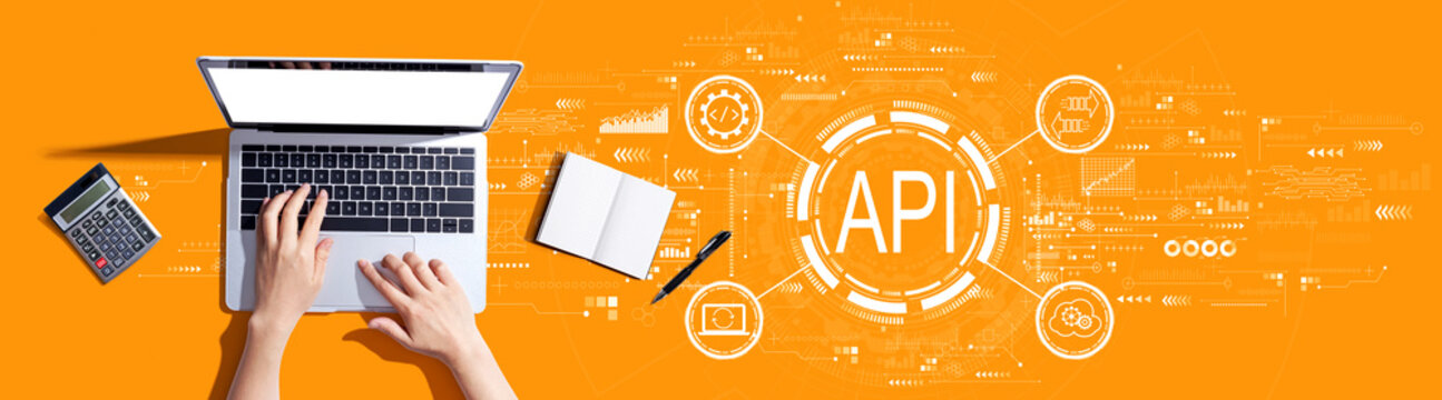 API - application programming interface concept with person using a laptop computer