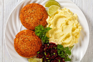 salmon patty with potato mash and beetroot salad