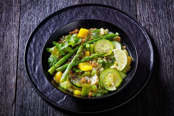 alkaline green soup in black bowl, top view
