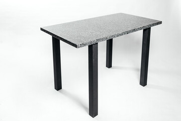 Granite table on metal racks on a white background